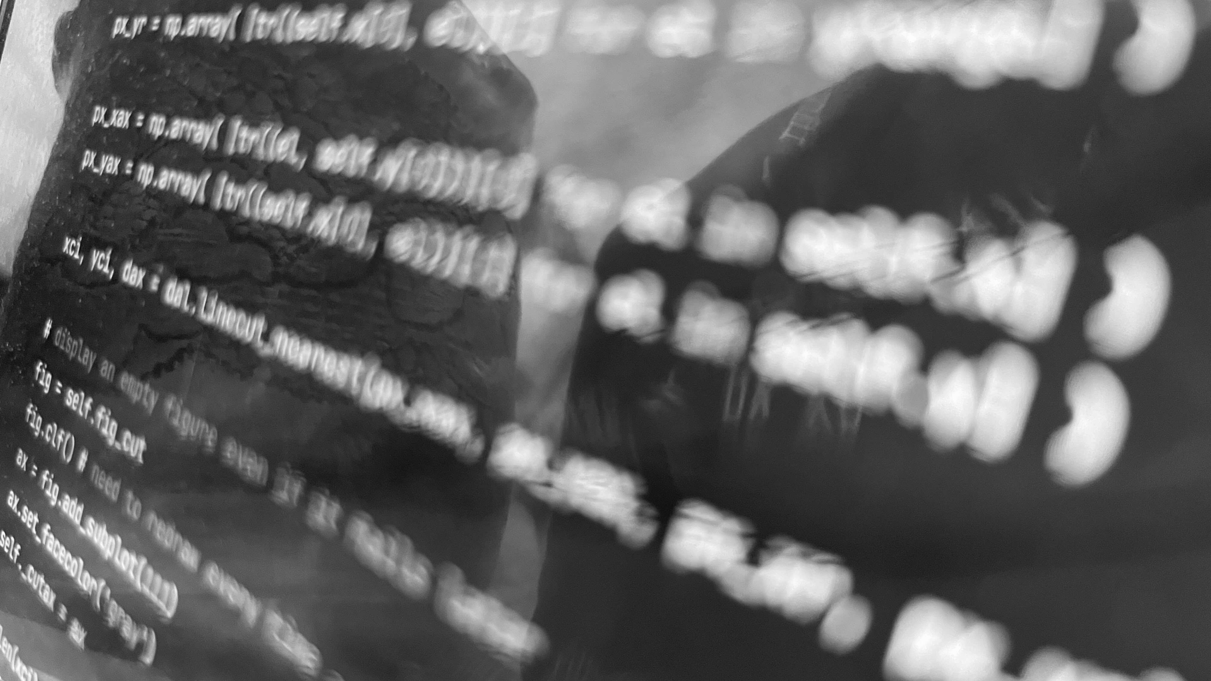 python code on a screen, photographed at an angle with shallow focus